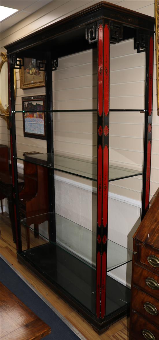 A Chinese lacquered display unit, with glass shelves, W.134cm H.214cm